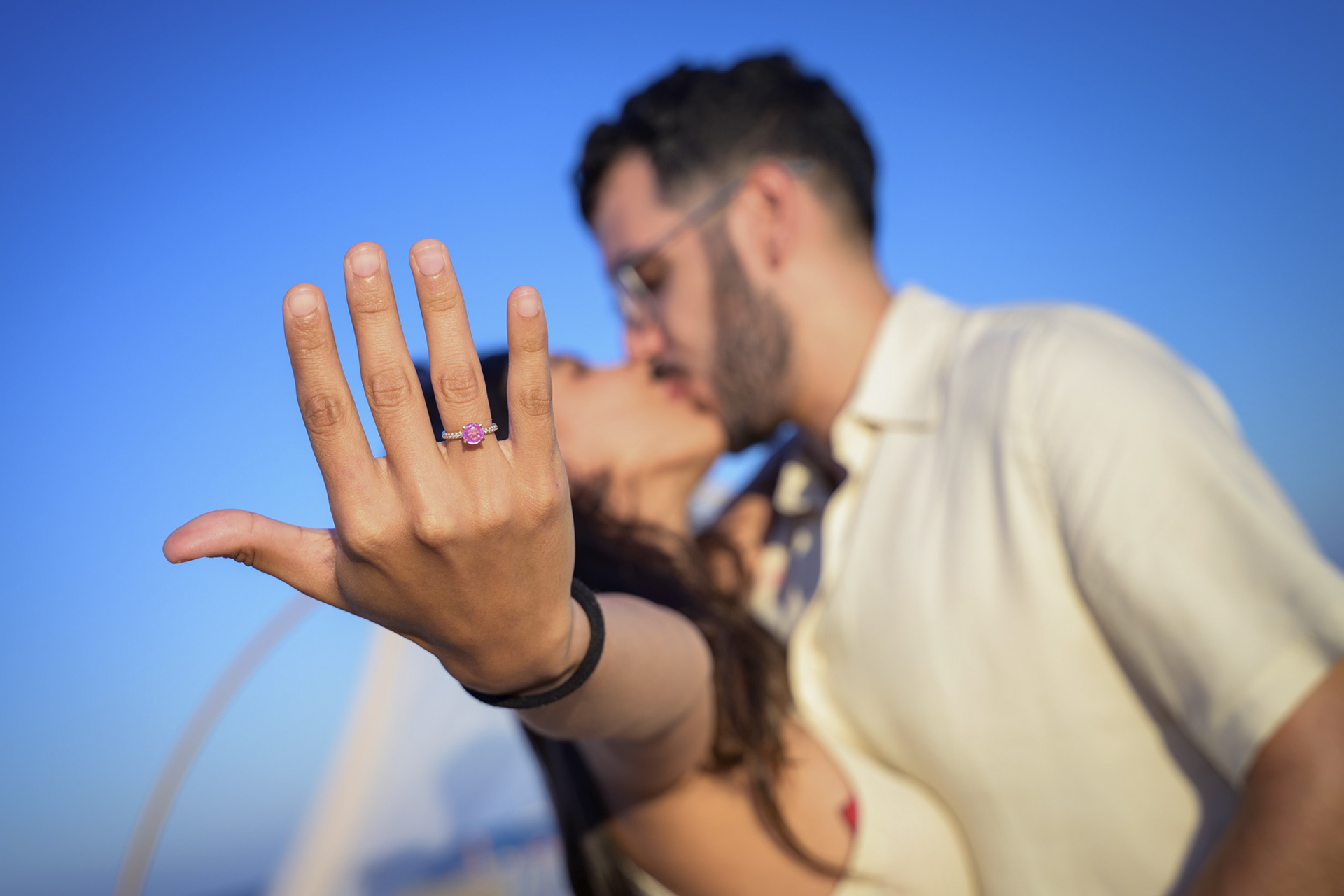 Romantic Proposal in Spain A couple proposing in Spain, with a romantic city backdrop.